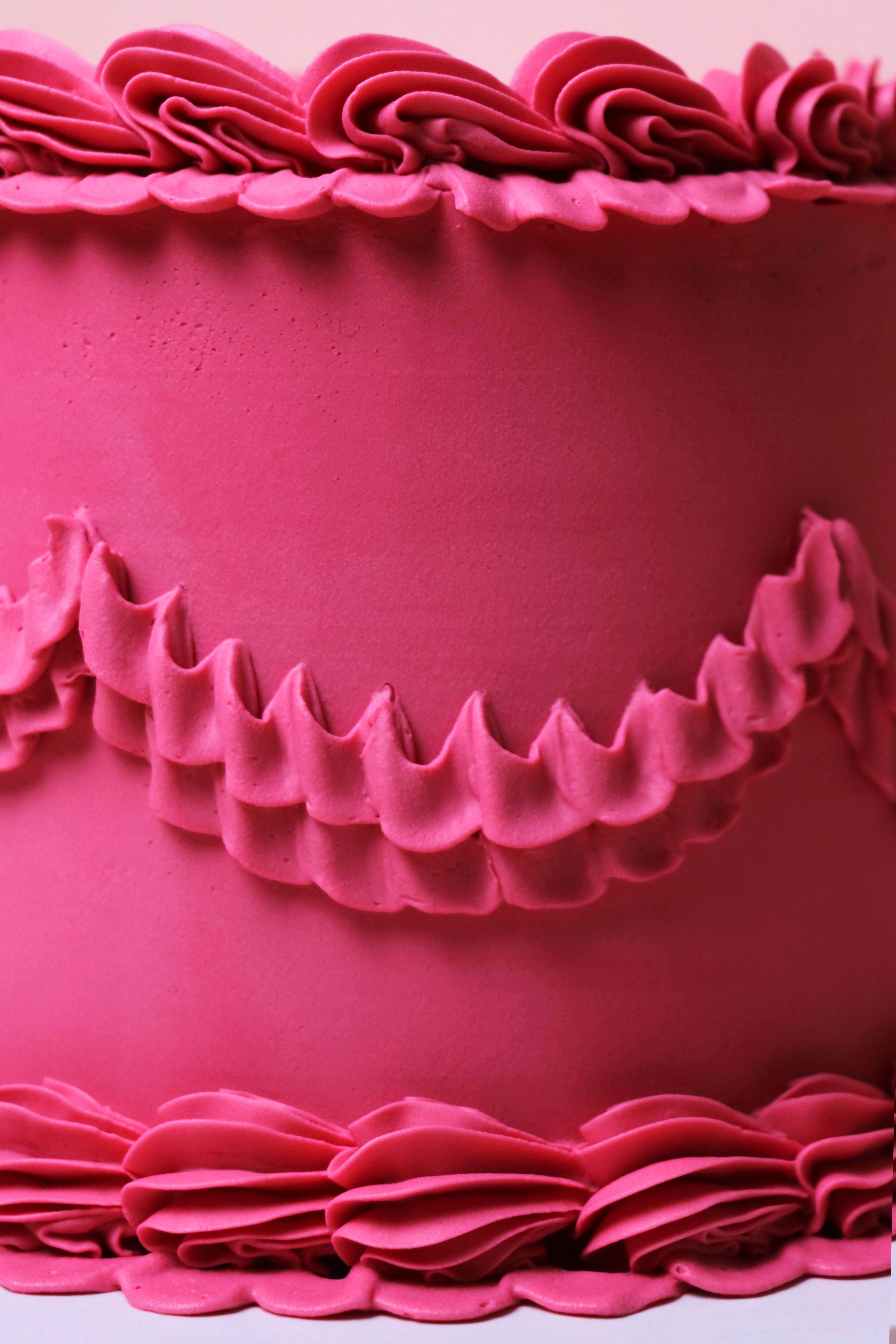 Close-up of decorative pink ruffles buttercream piping on minimalist cake from Cakeasion Shop - serving Uxbridge, Hayes, and surrounding west london areas