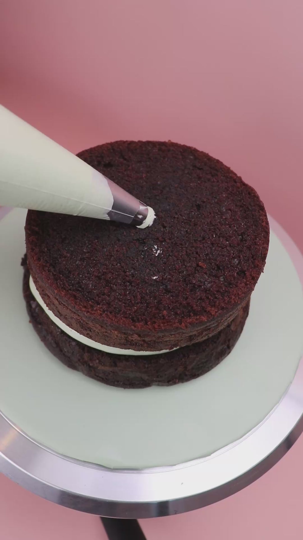 Video of the piping of a Mint chocolate dome cake with piped chocolate buttercream design, Swirl piped chocolate dome cake with mint buttercream filling, Dome-shaped chocolate cake with rich buttercream texture made by Cakeasion in Uxbridge.